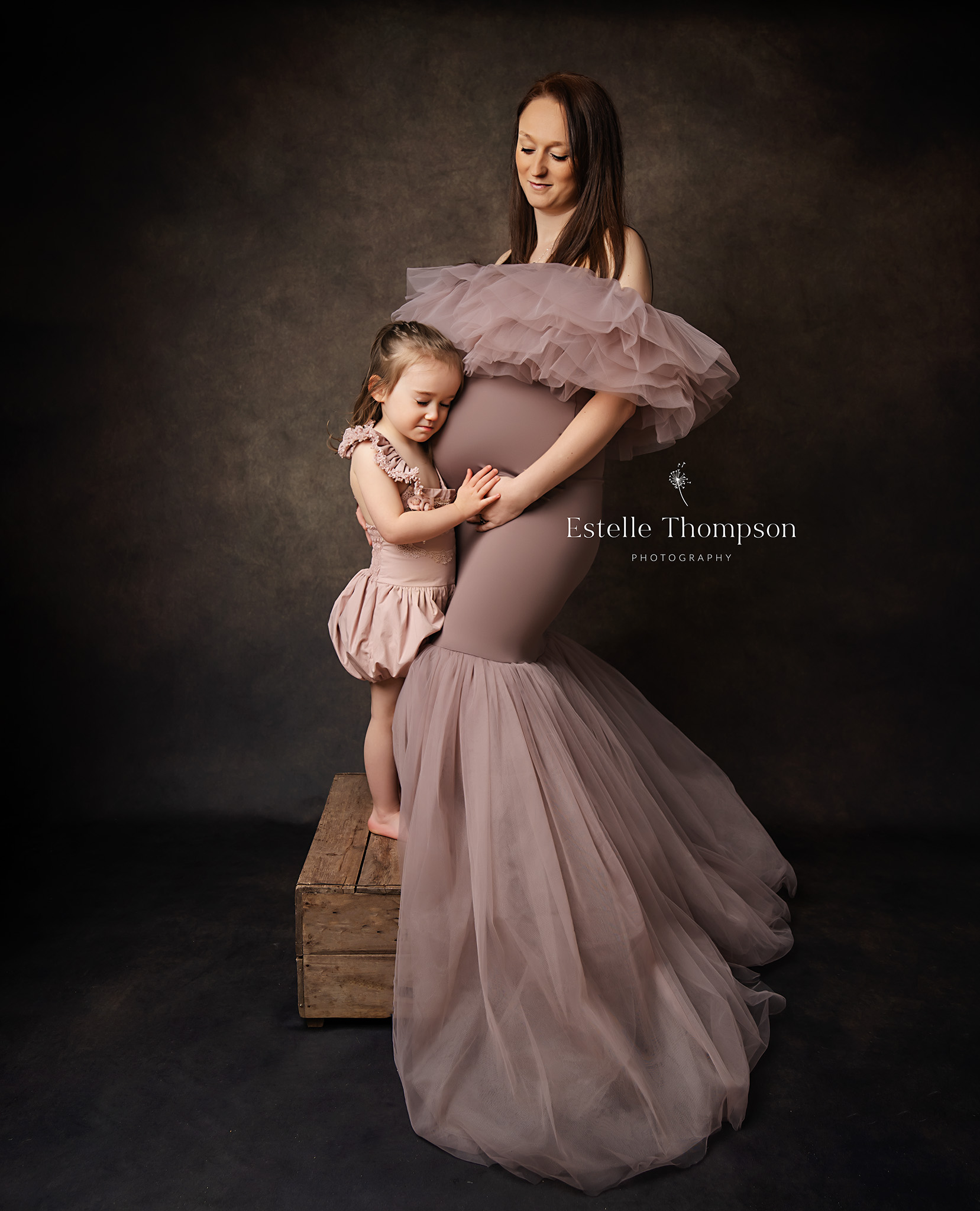 Pregnant lady wearing maternity dress on a Maternity photoshoot